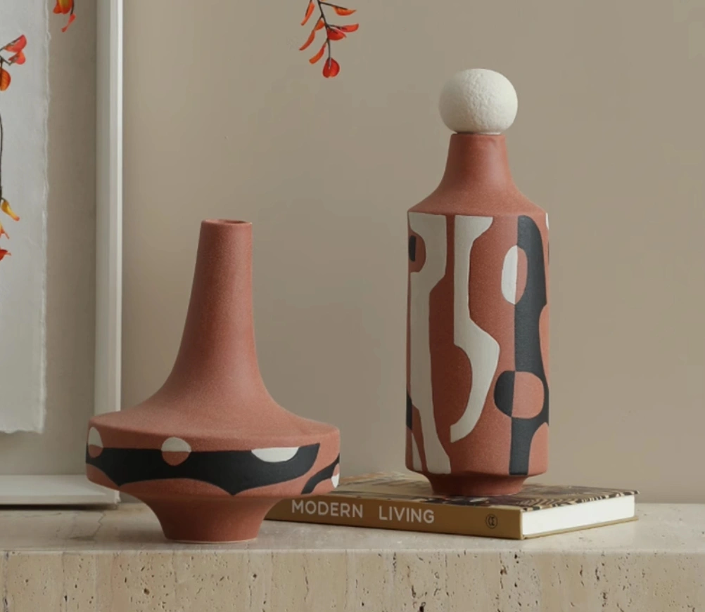Simple, modern, creative black and white painted red ceramic art ornament for living room TV cabinet, entryway tabletop, vase decoration.